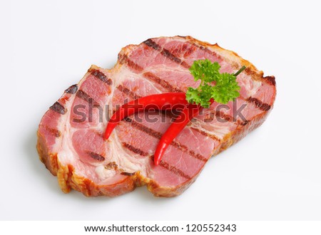 Grilled slice of smoked pork neck
