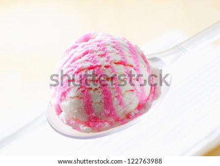 Scoop of strawberry lemon ice cream on spoon