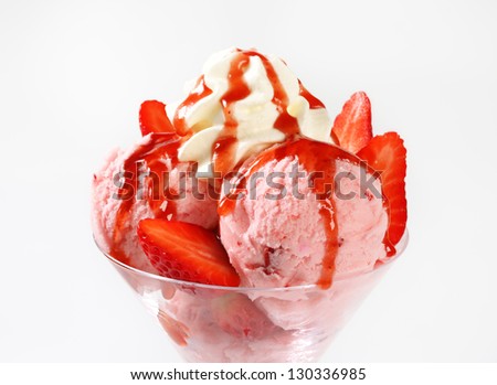 strawberry ice cream sundae with whipped cream on top