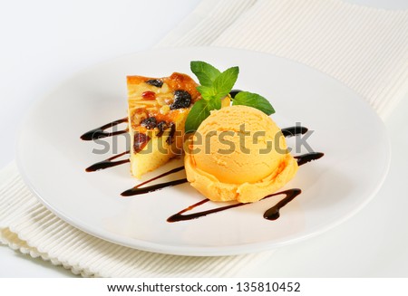 dessert consists of ice cream and piece of honey cake