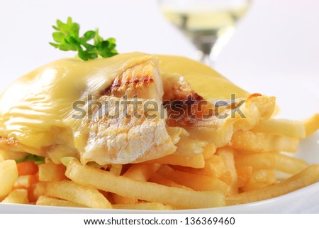 fish fillet with melted cheese and french fries