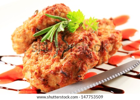 two fried burgers with herbs