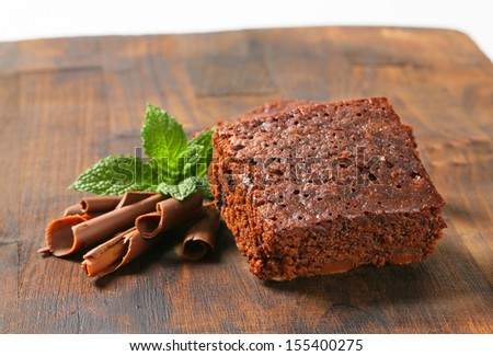 piece of brownie with chocolate curls and mint