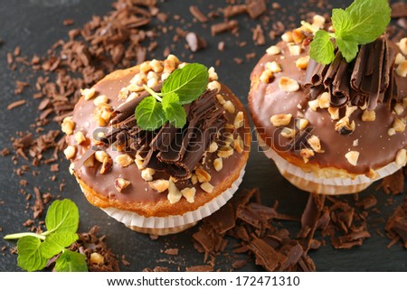 muffins with chocolate and sprinkled with chocolate flakes