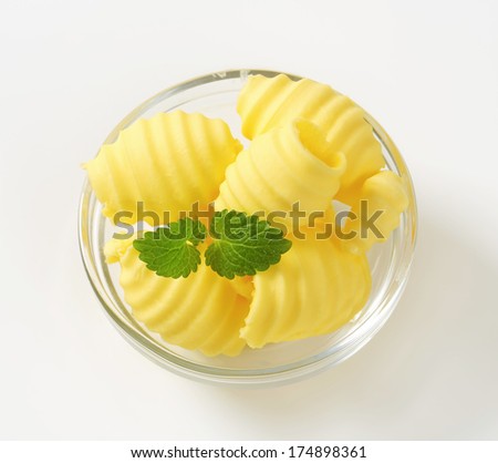 smooth butter curls in a glass bowl