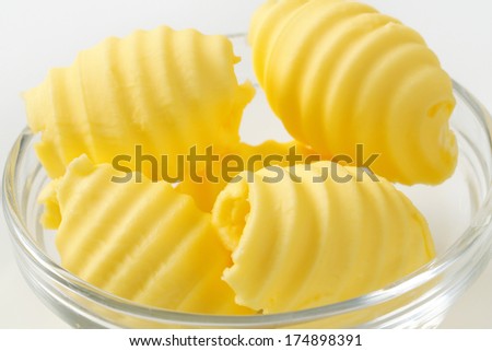 detail of bowl with portioned butter curls