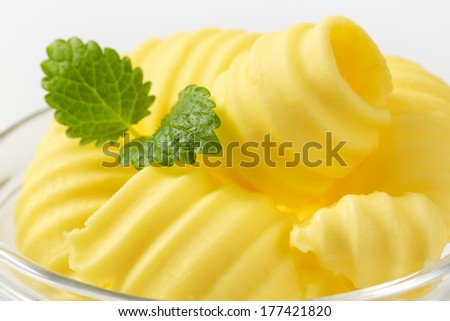 macro detail of butter curls with parsley