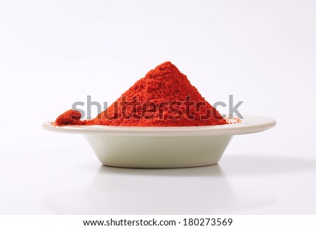 pile of ground red pepper, on the plate