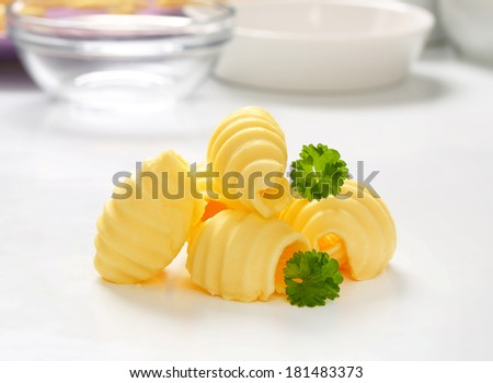 measured butter curls with kitchen background