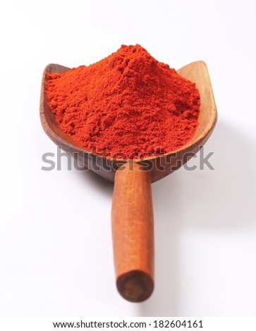 red ground pepper on the wooden shovel