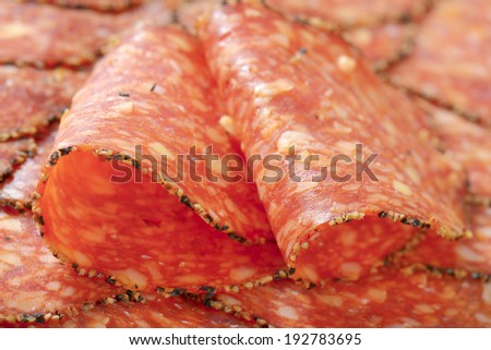 full frame of formed and folded salami slices