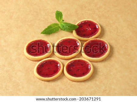 six fruit jam cakes with piece of mint