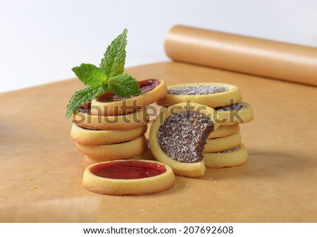 two kinds of cookies on the brown baking paper