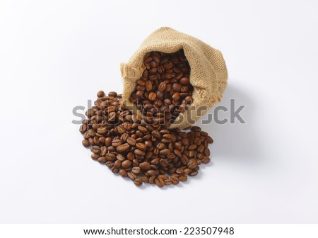 overhead view of burlap bag with roasted coffee
