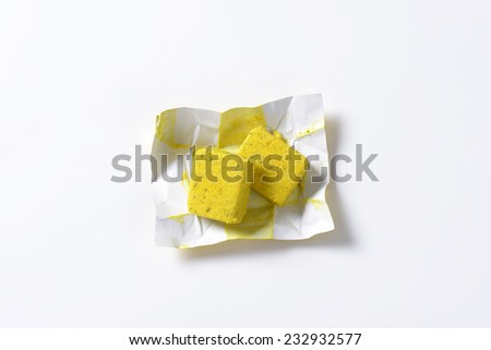 two bouillon cube in the paper wrapper