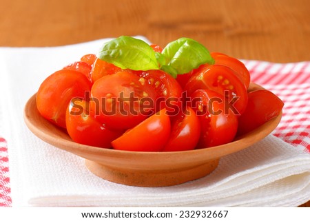 freshly halved cherry tomatoes as a healthy snack