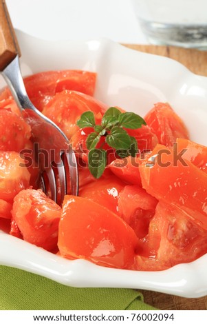 Tomatoes cut into sections in a bowl