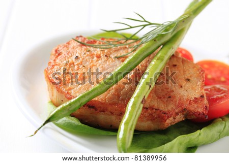 Marinated pork chop accompanied with vegetables