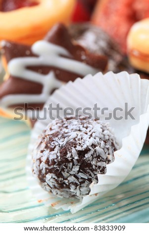 Coconut-coated chocolate ball in paper cup