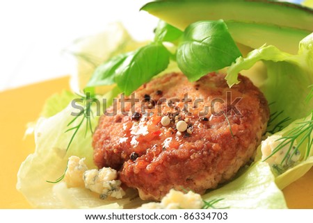 Meat patty on lettuce