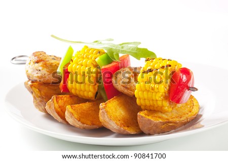 Chicken and corn skewer with potato wedges