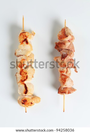 Chicken and pork meat skewer above