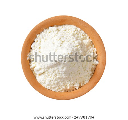 overhead view of finely ground flour in terracotta bowl