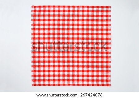 red and white checkered napkin on white background