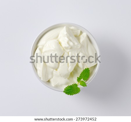overhead view of fresh plain yogurt in the bowl