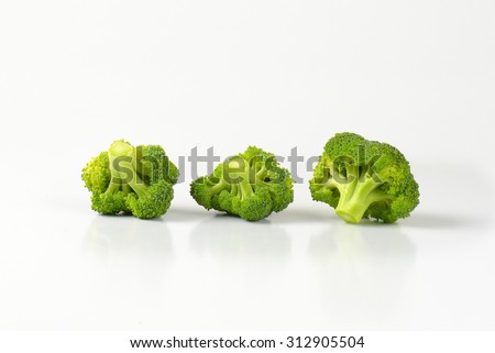 three small pieces of bright green fresh broccoli