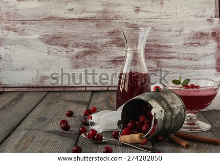 Cranberry jelly, cranberry juice and frozen cranberry on an old table background.Selective focus.