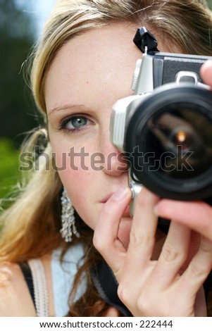 young woman holding camera