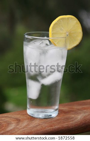 Cool cup of iced water with sliced lemon on top