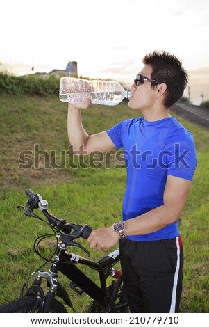 mountain biker drinking water