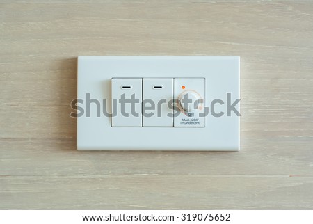 Dimmer switch and light switch on switchboard