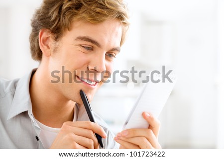 young male professional student is motivated studying at home