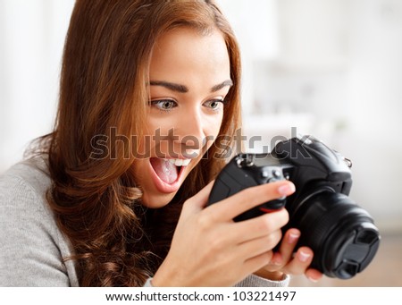 ecstatic photographer looking at photo