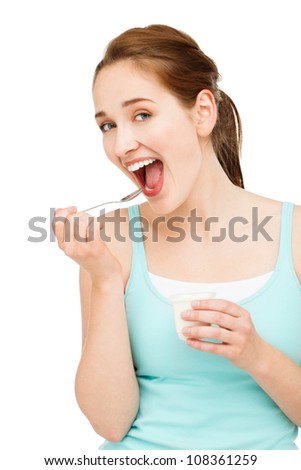 High key Portrait  young caucasian woman eating yogurt isolated on white background