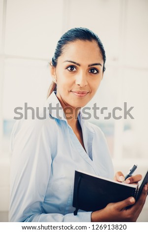 Beautiful young Indian business woman portrait happy smiling