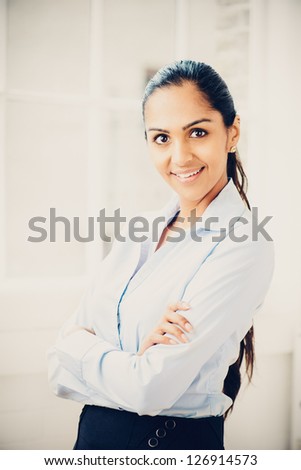 Beautiful young Indian business woman happy smiling