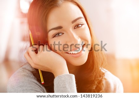 Woman college student studying at home portrait smiling