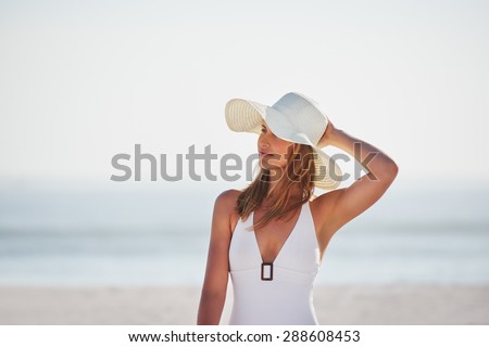Portrait of beautiful woman wearing stylish bathing suite on luxury vacation