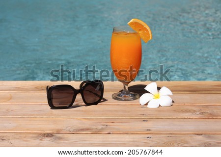 Cocktail, sunglass,  flower and swimming pool so relexing