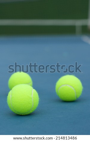 Yellow Tennis ball on the blue court