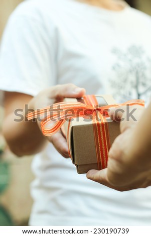 Women Hands giving and receiving a present