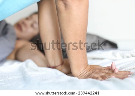 Woman relaxing while having a hand massage at the health spa