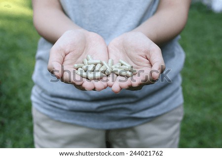 Hand holding Organic capsule medicine for good health and good life