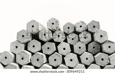 The pile of hexagon concrete foundation piles isolated in white background