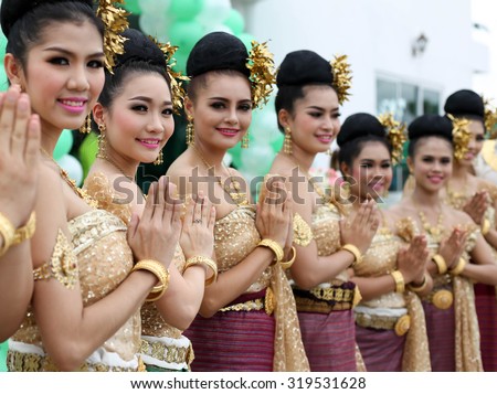 Ayutthaya Thailand - Sep 17, 2015: Group of Thai dancers all in smile pay respect int traditional Thai dresses