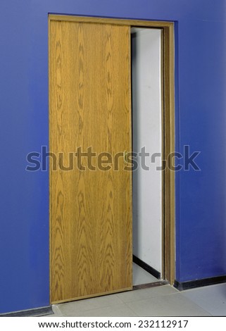 Image of closed wooden security door